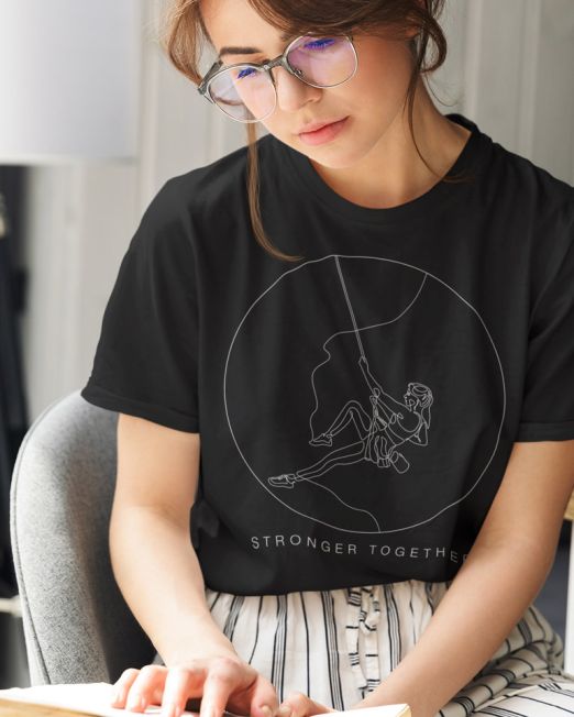 Stronger Together Womans Rock Climbing Black Relax Minimal Outdoor Tshirt Apparel Design of a Girl in glasses reading a book in her bedroom