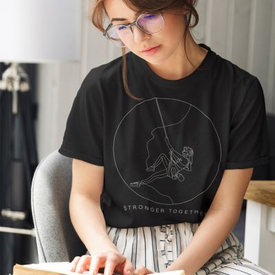 Stronger Together Womans Rock Climbing Black Relax Minimal Outdoor Tshirt Apparel Design of a Girl in glasses reading a book in her bedroom