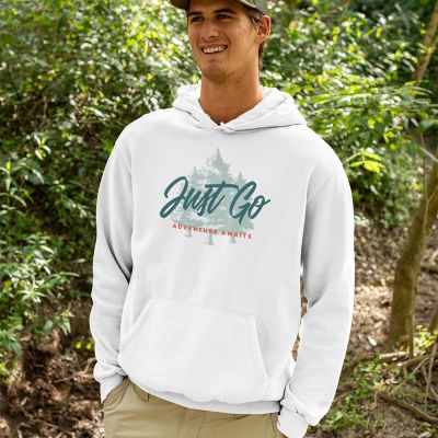 Just Go Adventure Awaits Travel and Nature Design of a happy man wearing a hoodie in the woods